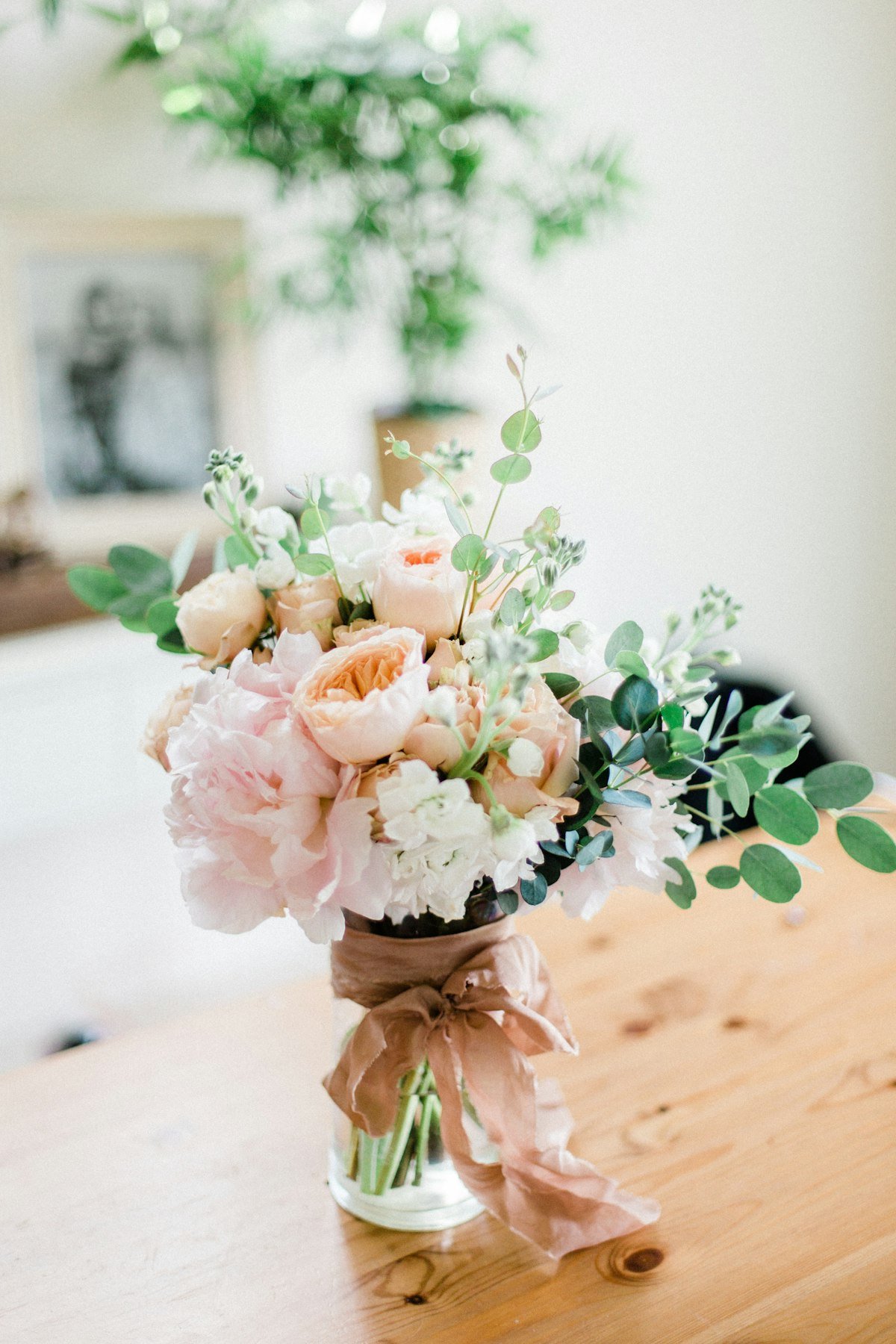 Handcrafted bouquet with garden roses and seasonal blooms